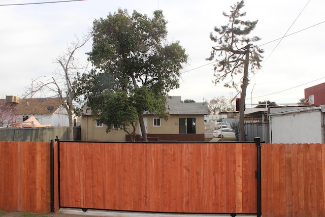 exterior space with stucco siding and fence