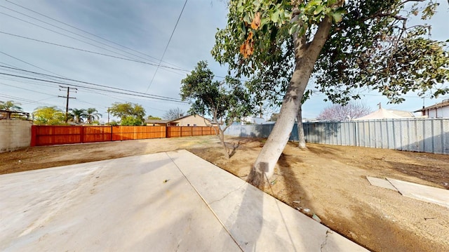 view of yard featuring a patio and a fenced backyard