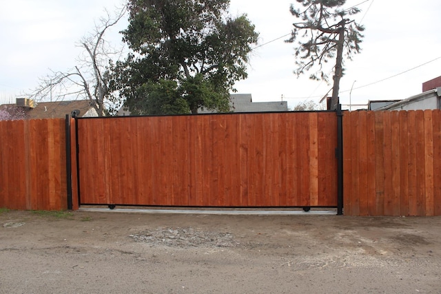 view of gate with fence