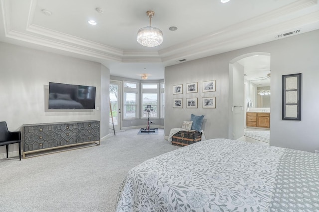 carpeted bedroom featuring arched walkways, a raised ceiling, visible vents, and crown molding