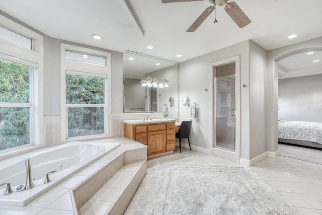 full bath featuring ensuite bathroom, vanity, a jetted tub, a shower stall, and tile patterned floors