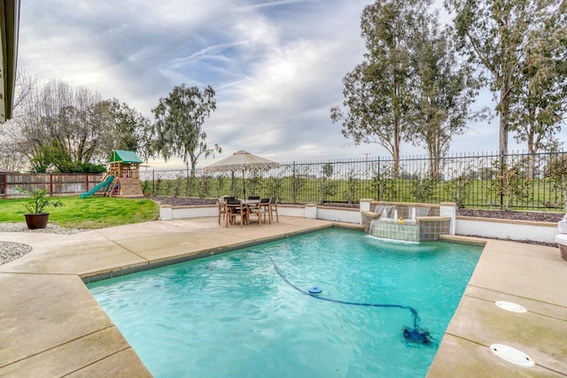 view of swimming pool featuring a fenced in pool, a playground, a yard, a patio area, and a fenced backyard