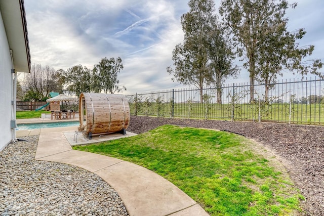 view of yard with a patio area and a fenced backyard