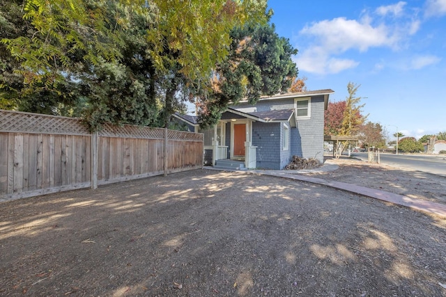 view of front of home featuring fence