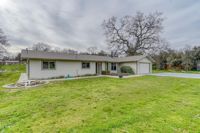 ranch-style home with a front lawn, driveway, and an attached garage