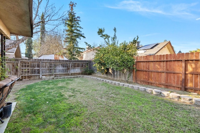 view of yard featuring a fenced backyard