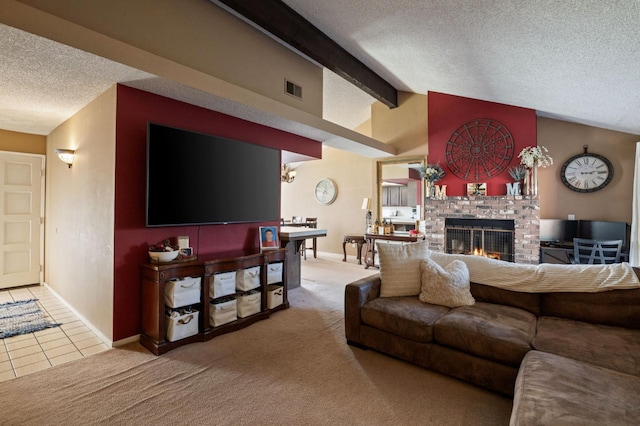 living room with carpet, vaulted ceiling with beams, a fireplace, visible vents, and a textured ceiling