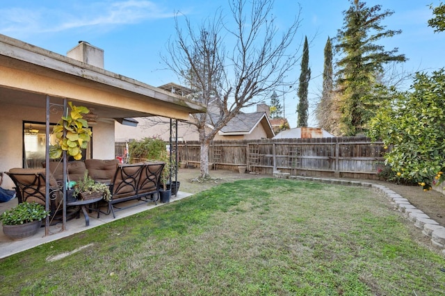 view of yard featuring a patio, fence, and an outdoor living space