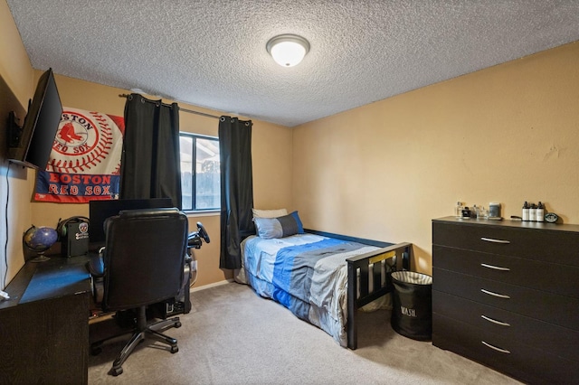 carpeted bedroom featuring a textured ceiling