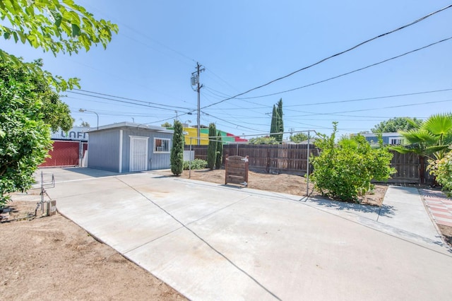 view of front facade with fence and an outdoor structure