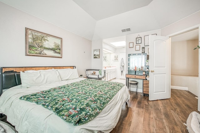 bedroom featuring dark wood-style flooring, visible vents, vaulted ceiling, and baseboards