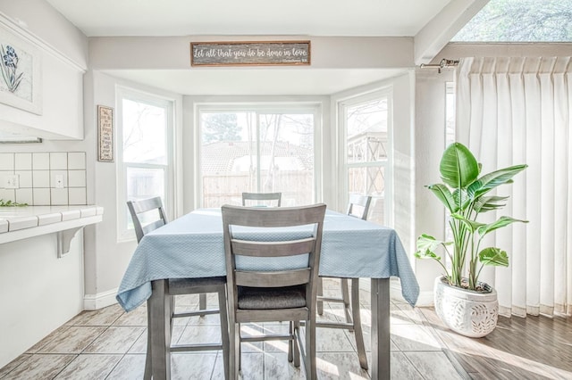 dining area featuring baseboards