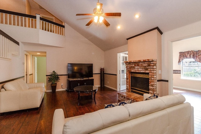 living area with ceiling fan, high vaulted ceiling, wood finished floors, baseboards, and a brick fireplace