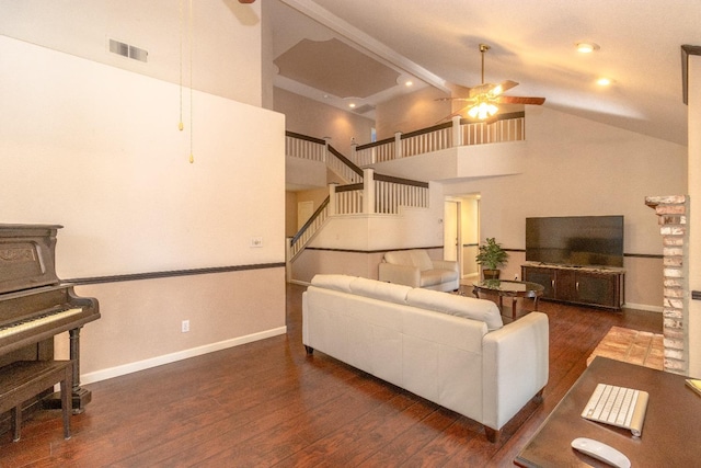 living room featuring baseboards, stairs, a ceiling fan, and wood finished floors