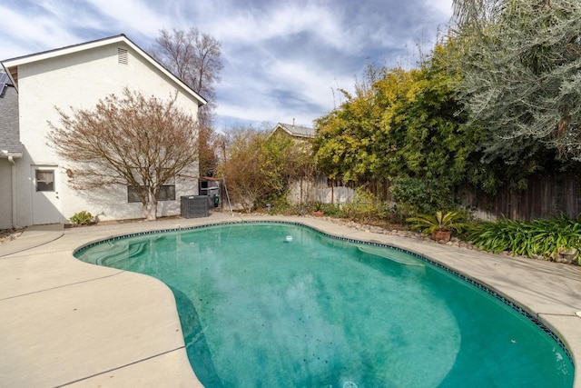 view of pool featuring a patio, a fenced backyard, and a fenced in pool