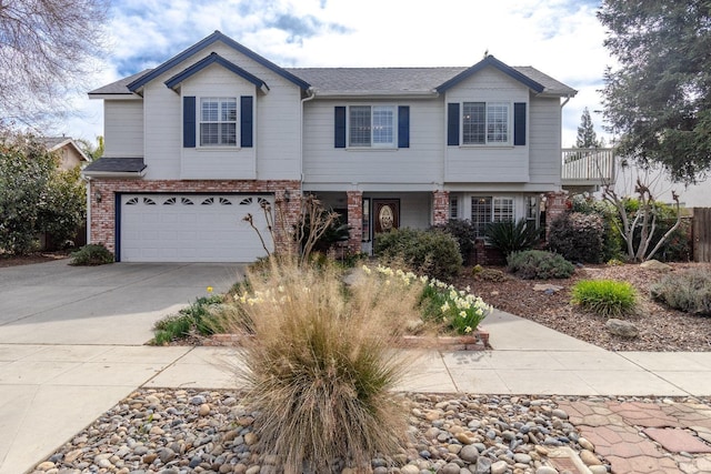 view of front facade featuring a garage, concrete driveway, and brick siding