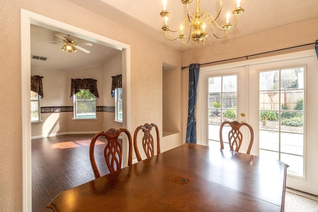 dining space with french doors, visible vents, a ceiling fan, wood finished floors, and baseboards