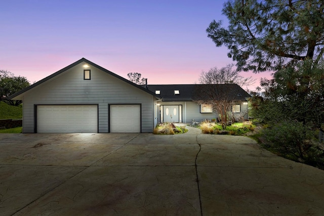 view of front facade with driveway and an attached garage