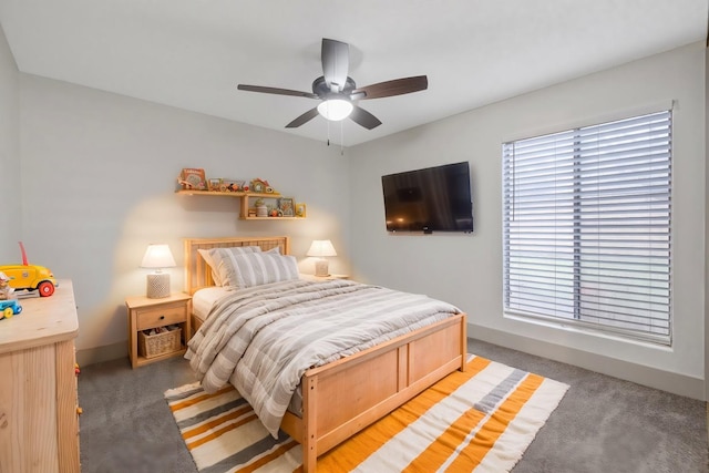 bedroom featuring baseboards, a ceiling fan, and light colored carpet