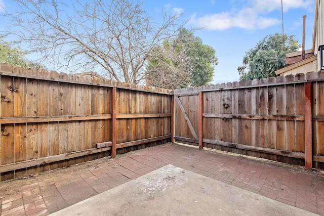 view of patio / terrace with fence and a gate