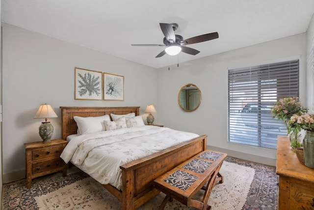 bedroom featuring baseboards and a ceiling fan