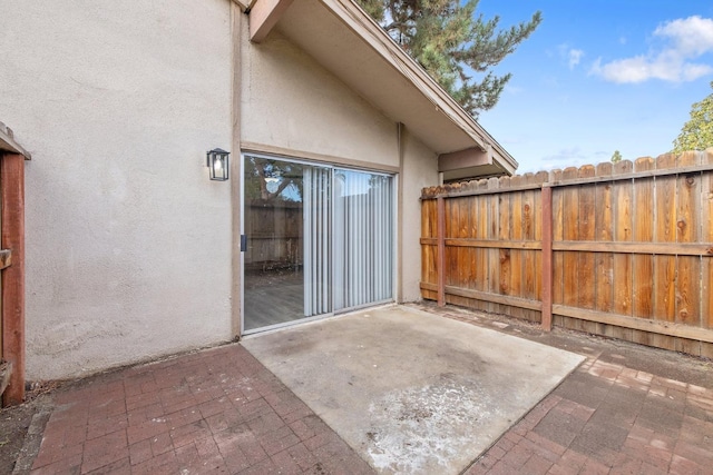 view of patio featuring fence