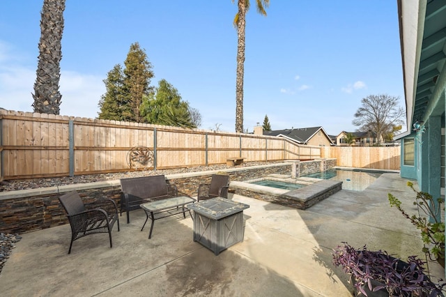 view of patio with an in ground hot tub, a fenced backyard, and a fenced in pool