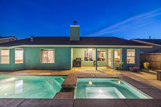 view of pool featuring a fenced in pool, grilling area, an in ground hot tub, fence, and a patio area