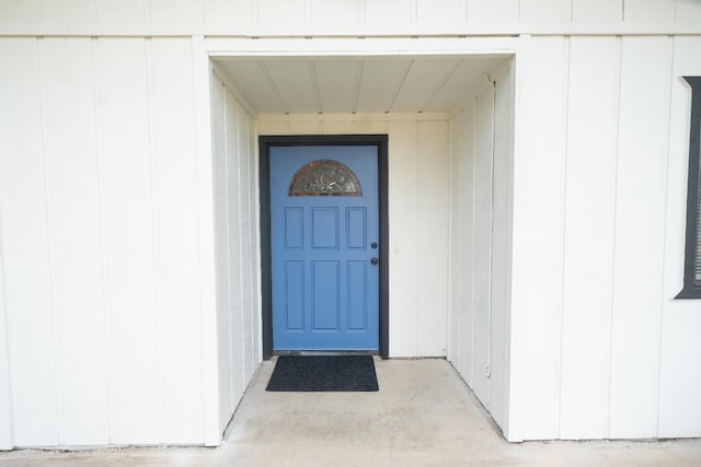 property entrance with board and batten siding