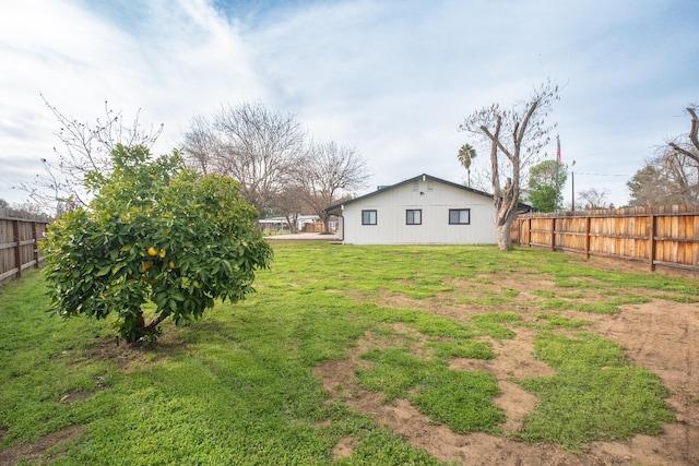 view of yard with a fenced backyard