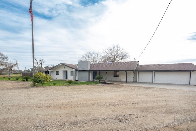 view of front of property with a garage and driveway