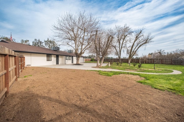 view of yard featuring a patio and a fenced backyard