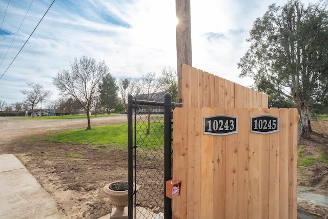 exterior details featuring a gate and fence