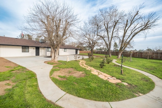 view of yard featuring a patio and fence