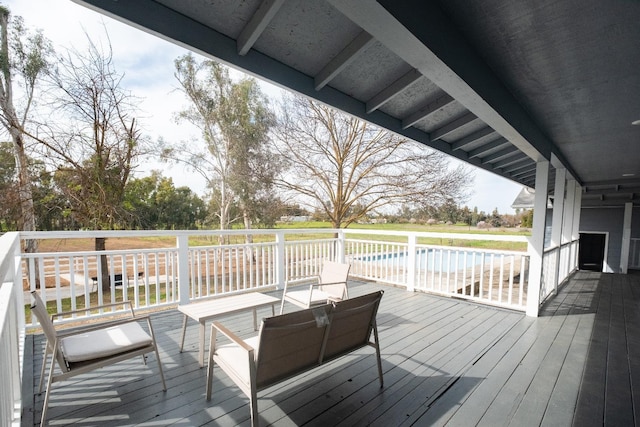 wooden terrace with outdoor lounge area