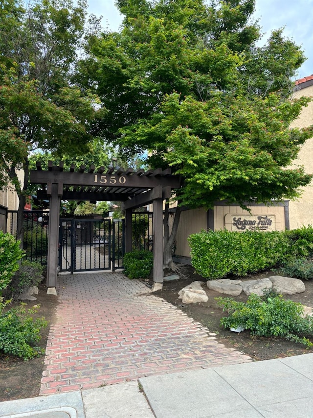 view of gate with fence