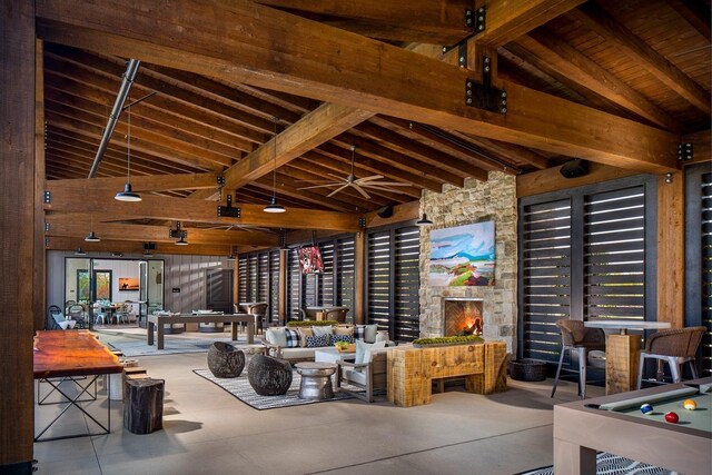 interior space featuring wooden ceiling, pool table, ceiling fan, and beamed ceiling