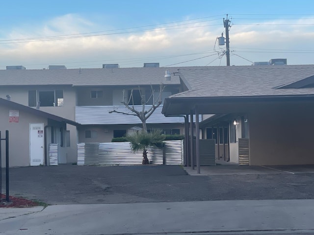 view of front of house featuring roof with shingles