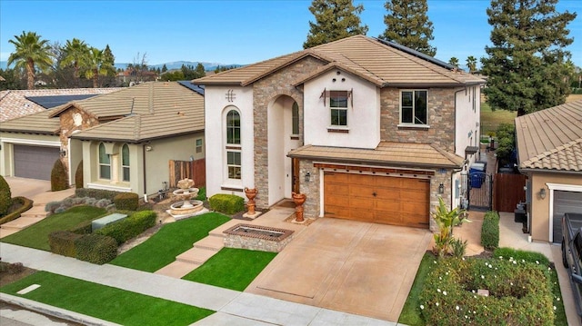 view of front facade with a garage, stone siding, solar panels, and concrete driveway