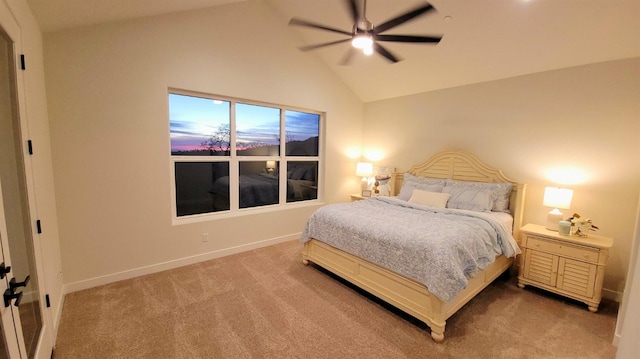 bedroom with ceiling fan, high vaulted ceiling, baseboards, and light carpet