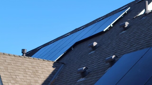 details featuring a shingled roof