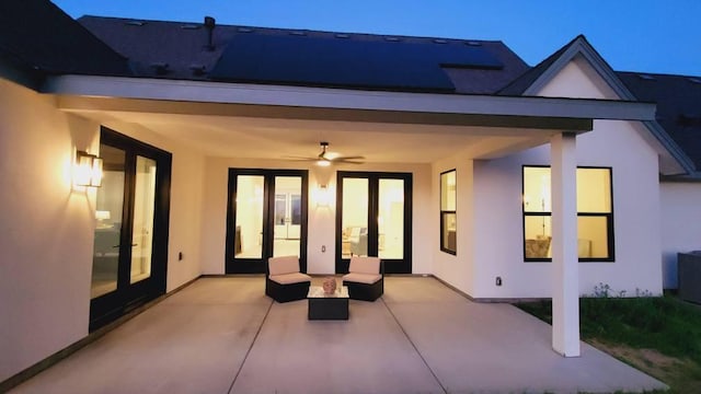 view of patio with french doors and ceiling fan