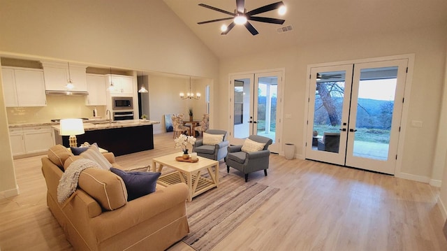 29030 Crystal Spings Ct, Coarsegold, CA 93614 - living area with ceiling fan with notable chandelier, visible vents, light wood-style floors, and french doors