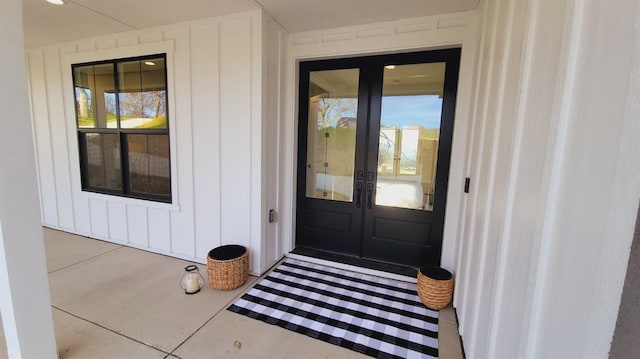 doorway to property featuring board and batten siding