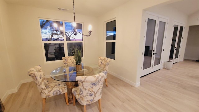 29030 Crystal Spings Ct, Coarsegold, CA 93614 - dining area featuring baseboards, french doors, wood finished floors, and a chandelier