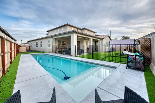 view of pool featuring a fenced in pool, a patio area, a fenced backyard, and a lawn