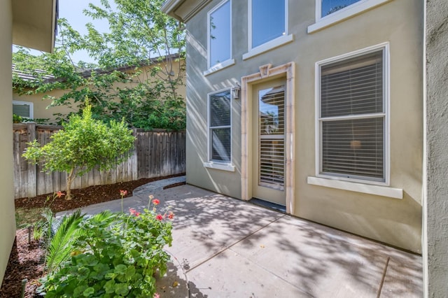 view of patio / terrace featuring fence