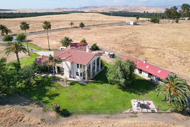 birds eye view of property with a rural view and a mountain view