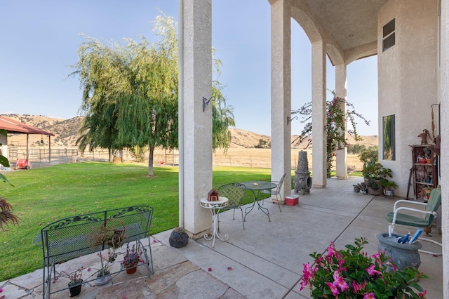 view of patio / terrace with a mountain view