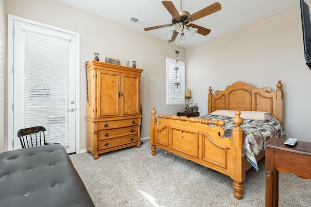 bedroom with visible vents, baseboards, light colored carpet, ceiling fan, and access to outside